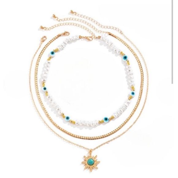 Multi strand layered necklace with evil eye faux freshwater pearls accented with - Picture 2 of 7